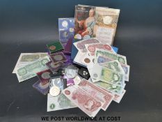 A quantity of UK coin collections, modern crowns and uncirculated banknotes including Maria Theresa,
