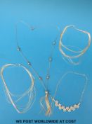 Four silver necklaces,