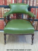 A 19thC green leather style upholstered armchair