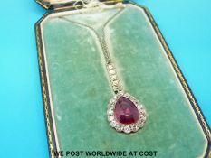 An Art Deco platinum necklace set with a pear cut synthetic ruby measuring approximately 5ct