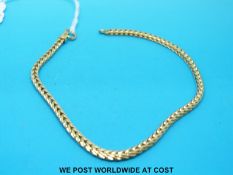 A yellow metal bracelet, marked 14k (10.