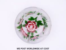 Baccarat primrose faceted glass paperweight, the central flower with red and white petals,