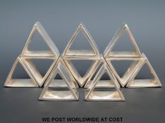 A set of 12 triangular napkin rings,
