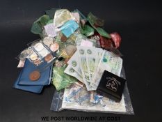 A collection of coins and bank notes including £1 notes,