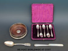 A feature hallmarked silver wine coaster,