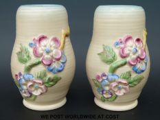 A pair of Clarice Cliff relief moulded vases with floral decoration (15cm tall)