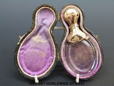 A 19thC engraved yellow metal-topped and possibly rock crystal scent bottle in original fitted case,