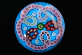 Clichy patterned millefiori glass paperweight with central pink,