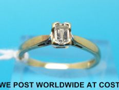 An 18ct gold ring set with a an emerald cut diamond of approximately 0.