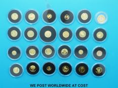 Twenty four various small / miniature gold coins in a wooden Westminster case