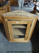 A glazed pine hanging corner cupboard (height 79cm)