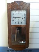 A c1910 oak cased three train wall clock together with a Bakelite Enfield two train mantel clock