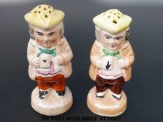 A pair of 19thC Staffordshire figural cruets in the form of toby jugs (15cm tall)