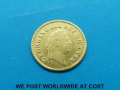A George III gold quarter guinea 1799