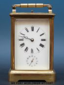 A Margaine half hour repeater and alarm carriage clock with white enamel dial and Breguet hands