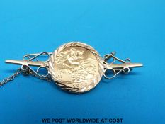 A yellow metal brooch set with a 1982 gold half sovereign (6.