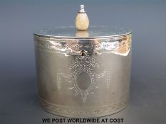 A Georgian hallmarked silver oval tea caddy with bright cut decoration and hinged lid, London 1782,