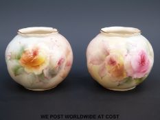 A pair of Royal Worcester squat vases decorated with roses (7cm tall)