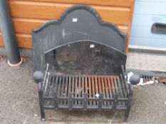 A bespoke fire grate and fireback