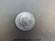 A 1886 young head cased Victorian Maundy four pence