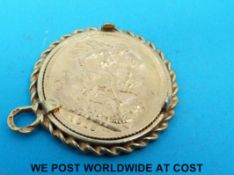 A 9ct gold pendant set with a 1918 gold full sovereign (10.
