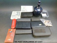 A collection of darts and accessories including flights