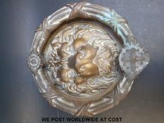 A large lion's mask door knocker,