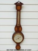 A Short & Mason barometer with inlaid shell pattern decoration and banding to the edges