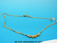 An Indian yellow metal necklace, marked 22ct (7.