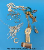 A collection of costume jewellery to include a gold chain, faux pearls,