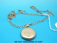 A 9ct gold necklace and a 9ct gold locket with chased decoration (25.