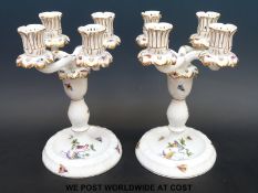 A pair of Herend four branch candelabra decorated with insects and birds