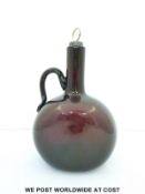 A William IV amethyst glass decanter with applied handle and hallmarked silver stopper B'ham 1832,