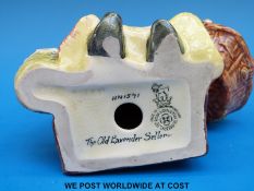 A Royal Doulton figure 'Old Lavender Seller' HN 1571