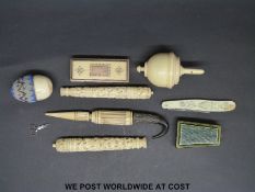 A small rectangular ivory box with gold inlay, a carved Chinese ivory needle case,