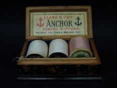 A small lacquer Anchor sewing cotton box and contents,