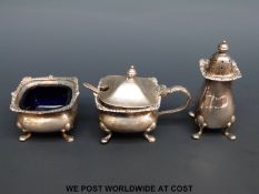A hallmarked silver three piece cruet set (weight of silver 112g)