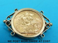A 9ct gold brooch set with a 1914 gold full sovereign (10.