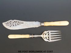 A pair of Victorian Elkington hallmarked silver fish servers with pierced decoration,