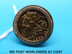 A 9ct gold ring set with a 1982 gold half sovereign (8.