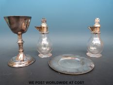 Four silver plated items to include a chalice and dish for use in a church together with two glass