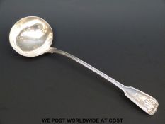 A Victorian hallmarked silver fiddle thread and shell pattern ladle, length 34cm,