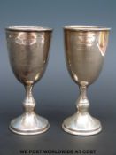A pair of hallmarked silver goblets, London 1956,