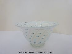 An indistinctly signed art glass bowl with blue decoration on a white ground (10cm tall,
