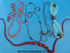 A collection of necklaces to include beaded coral, carnelian agate, bakelite beaded,