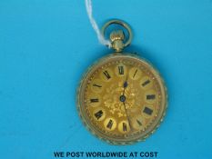 A yellow metal ladies fob watch, 18k stamped to highly engraved case and dial,