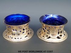 A pair of Irish hallmarked silver pierced and flared dishes or potato rings decorated with pastoral