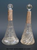 Two hallmarked silver tapering cut glass hallmarked silver mounted scent bottles,