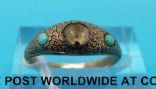 A yellow metal ring set with turquoise (size K/L)