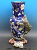 A large majolica vase with applied dragon decoration,